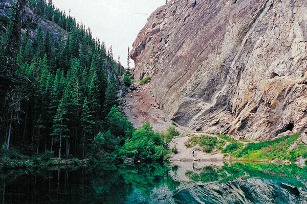 Ancient Devonian reef structures in limestone cliffs above Grassi Lakes, Canmore Alberta — the same rock formation containing Rat's Nest Cave